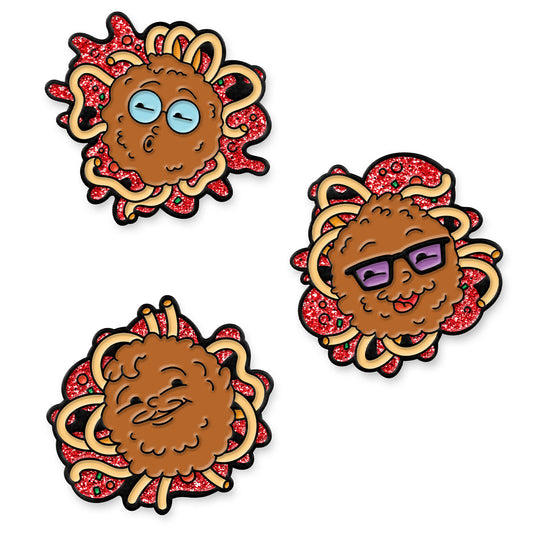 A mockup of 3 soft enamel pins featuring each of the McElroy brothers as a meatball on a splash of spaghetti noodles and glittery sauce.