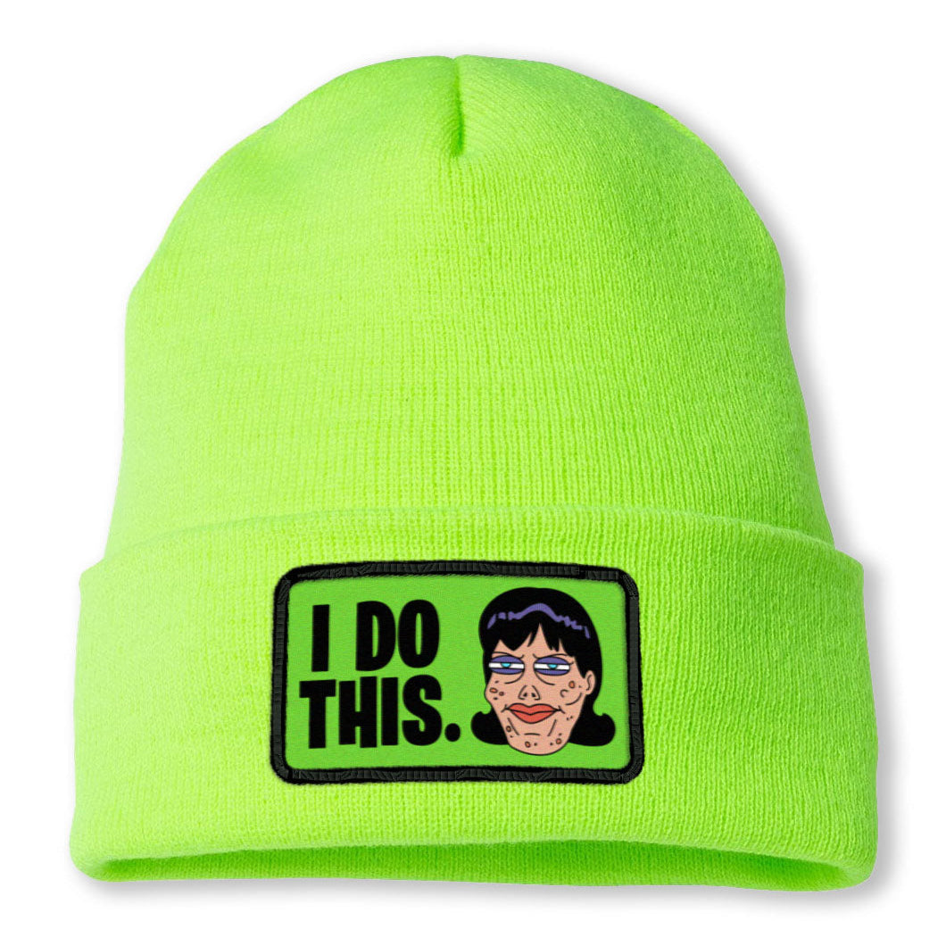A digital mockup of a green beanie with a patch on the front cuffed brim. The patch is green with a cartoon of Final Pam's face and the text "I do this."