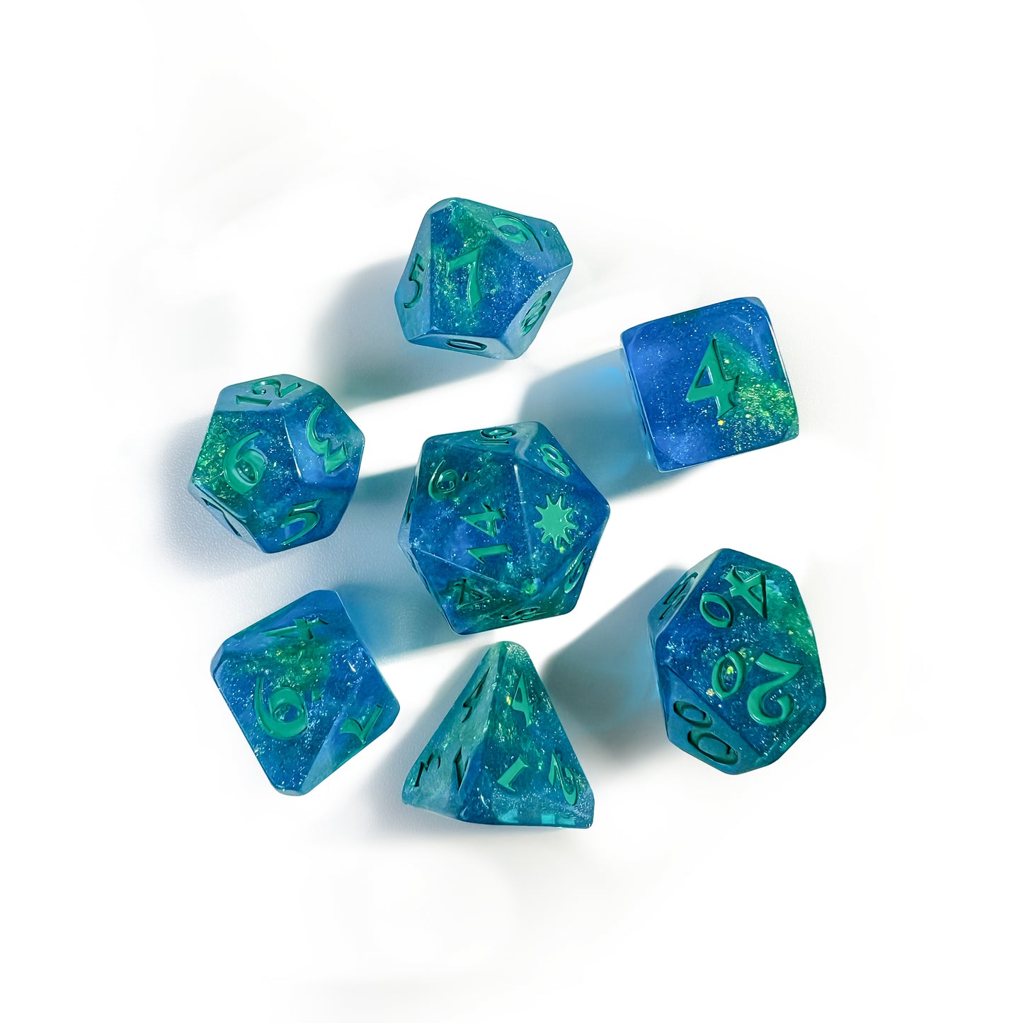 Aqua blue resin dice with seafoam green glitter throughout and matching seafoam green numbers. Dice displayed are 1 D4, 1 D6, 1 D8, 2 D10s, 1 D12, 1 D20. D20 has a 9 pointed star on the D20 face.