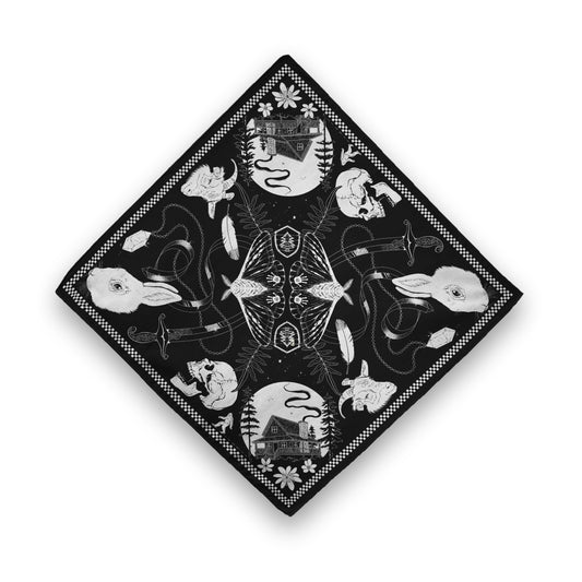 A black bandana with white illustrations inside a checkerboard border. From the center outward, there are illustrations that are mirrored on the other side: a moth with its wings spread, a Parks Ranger emblem, a fern, a bendy sword, a feather, a crystal on a chain, a goat’s head, a skull, a rabbit’s head, a house lit by a full moon, and a bigfoot walking across the border
