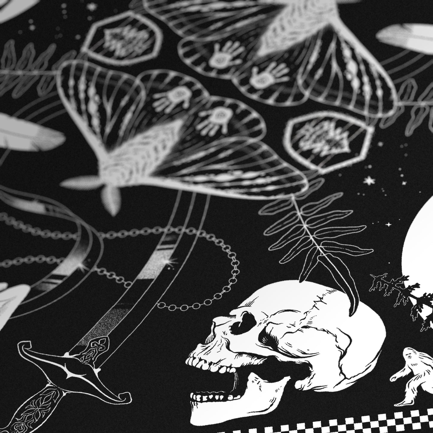 A black bandana with white illustrations inside a checkerboard border. From the center outward, there are illustrations that are mirrored on the other side: a moth with its wings spread, a Parks Ranger emblem, a fern, a bendy sword, a feather, a crystal on a chain, a goat’s head, a skull, a rabbit’s head, a house lit by a full moon, and a bigfoot walking across the border