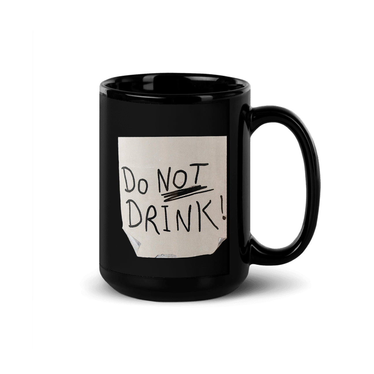 15 oz black mug with a print to look like a distressed post it note with the text DO NOT DRINK scribbled on it in black marker.