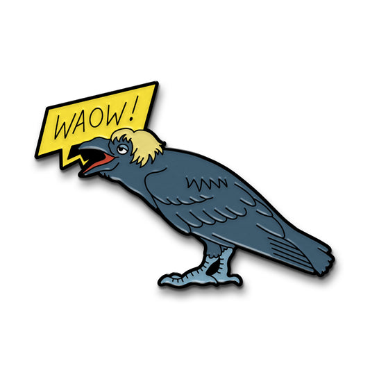 Enamel pin of a crow facing left, with a rectangular yellow speech bubble that says "Waow!". The crow has a sleepy expression and a messy blonde wig on.