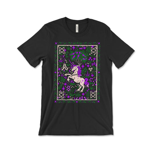 A black tee shirt with an illustration of Garyl the bi-nicorn. Garyl has a curly purple mane and tail and is surrounded by purple flowers and green foliage. There’s a white border with the B.O.B. emblem in each corner.