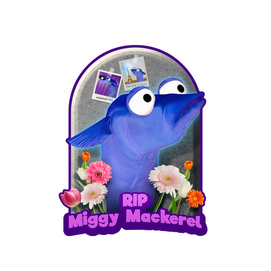 Illustrated Miggy the mackerel with flowers near its neck in front of what appears to be a headstone. The words RIP Miggy Mackerel in purple on the bottom.