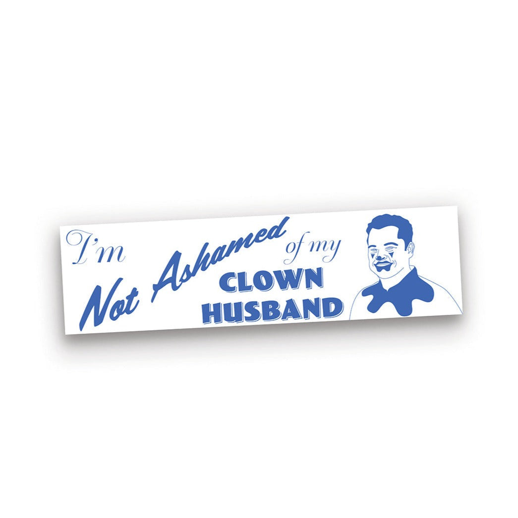 A white sticker with bright blue writing that says, “I’m not ashamed of my clown husband”. To the right is Justin wearing clown makeup.