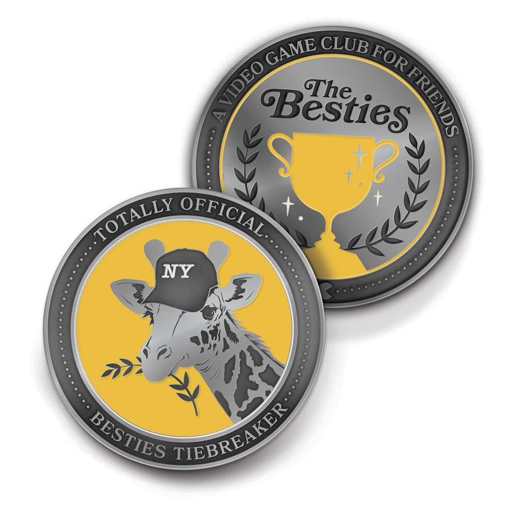 Image of the heads and tails of a coin. The coin is silver with black and yellow enamel graphics. The heads side says, “Totally official Besties tiebreaker,” with a silver and black giraffe head eating a laurel. The tails side says, “A video game club for friends,” at the top and “The Besties,” in the center. Below that is a yellow trophy with silver and white sparkles. It is surrounded by laurels. 