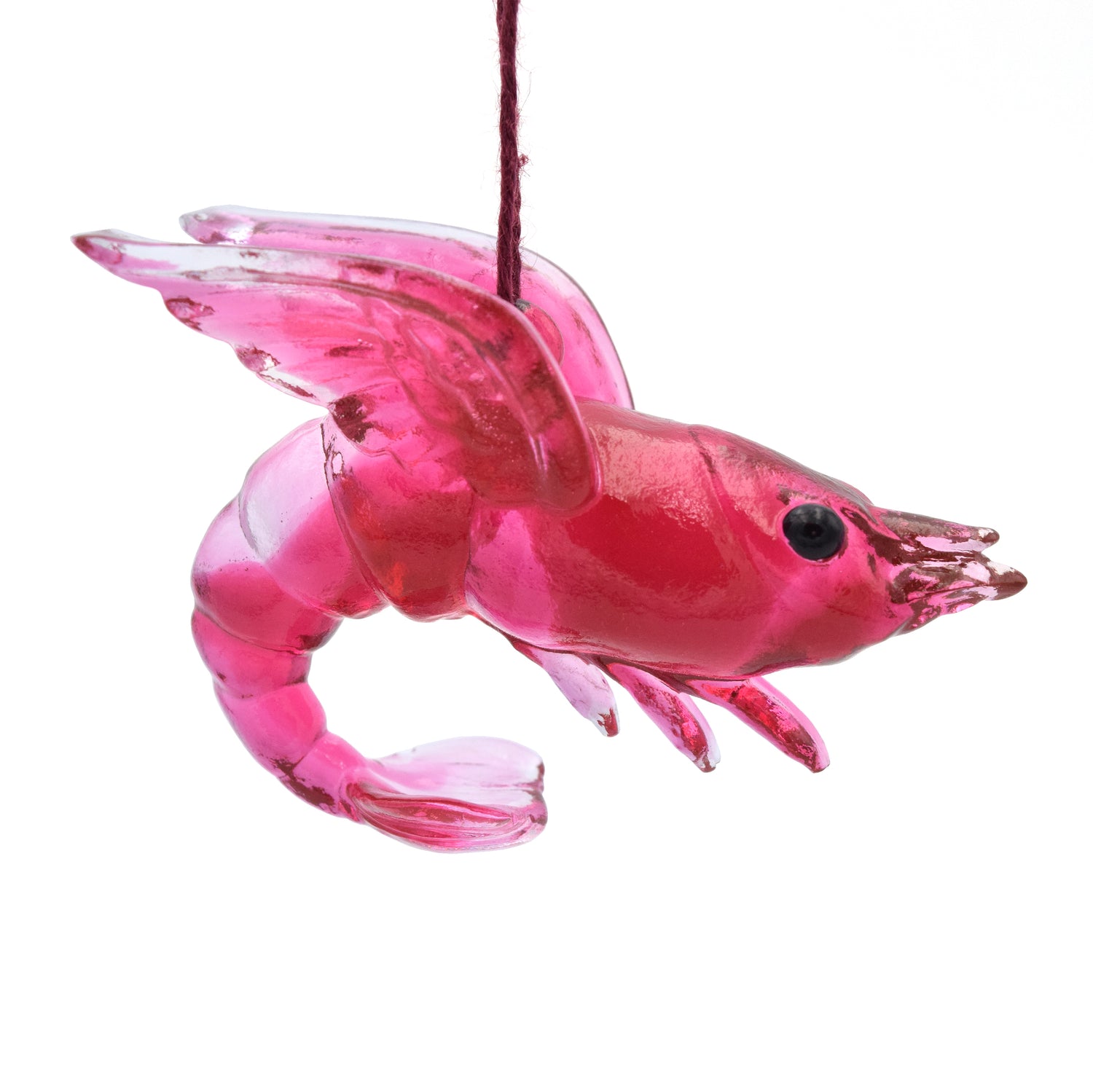  A translucent red shrimp ornament. The shrimp has wings and beady black eyes.