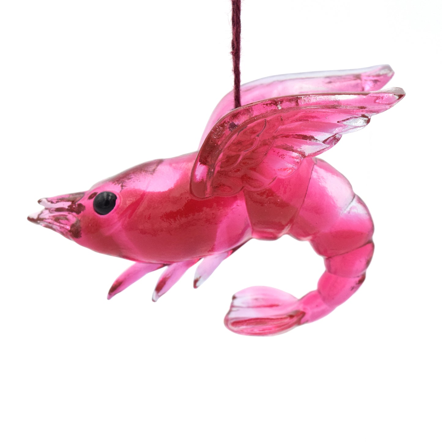 A translucent red shrimp ornament. The shrimp has wings and beady black eyes.