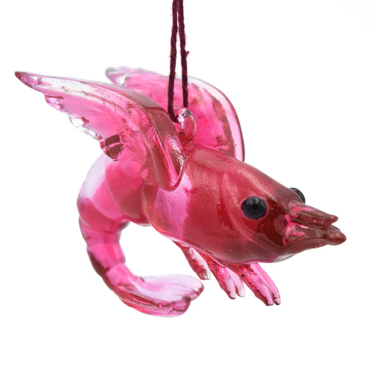 A translucent red shrimp ornament. The shrimp has wings and beady black eyes.
