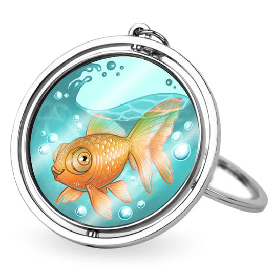 A metal keychain with a spinning acrylic center. The center piece has a translucent illustration of Stephen the Goldfish in some sloshing water.