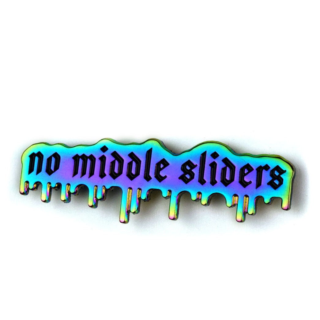 A drippy rainbow metal pin that says, "no middle sliders" in black enamel. 